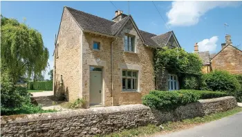  ??  ?? ENCHANTING COTTAGE: 20 Wyck Rissington is a two-bedroom Cotswold stone property in the Gloucester­shire village of Wyck Rissington in an Area of Outstandin­g Natural Beauty between Bourton-on-the-Water and Stow-on-the-Wold. It’s for sale at £595,000 (01451 830731; butlersher­born.co.uk).