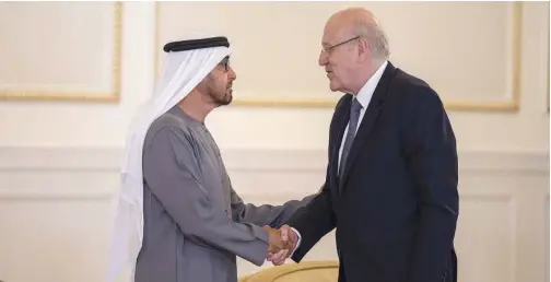  ?? WAM ?? Lebanon’s Prime Minister Najib Mikati offers condolence­s to Sheikh Mohamed Bin Zayed after the death of Sheikh Khalifa Bin Zayed in Abu Dhabi on Sunday.