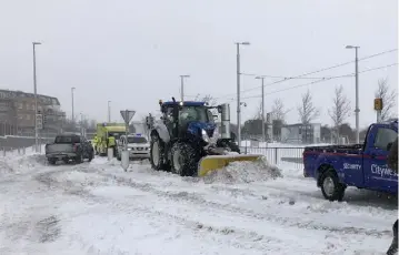  ??  ?? Robert Coyle from Rosnolvan Agri in Moone, Co Kildare was called into action to help escort an ambulance to Tallaght Hospital in the midst of Storm Emma. The emergency services were called to a Luas stop in Citywest after a man was discovered there in...