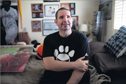  ?? PHOTOS BY RANDY VAZQUEZ — BAY AREA NEWS GROUP ?? Bryan Stow, above, sits in his Capitola bedroom Feb. 3. He was attacked in the Dodger Stadium parking lot nearly 10 years ago and barely survived. The scar on Stow’s head, below, is one of the lingering physical signs from the 2011 assault.