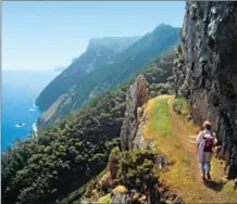  ?? TURISMO DA MADEIRA ?? A lone hiker enjoys the rugged Copia de Madeira coastline.