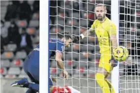  ?? (Photo: AFP) ?? Paris Saint-germain’s Italian midfielder Alessandro Florenzi (left) scores a goal during the French L1 football match between Nimes and Paris Saint Germain at the Costieres Stadium in Nimes, southern France, yesterday.