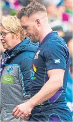  ?? SNS. ?? Top: Sam Johnston touches down for Scotland’s only try; far right: Finn Russell is brought down before laying the ball off for Johnston; right: players celebrate the try; left: Stuart Hogg troops off the pitch early in the first half after picking up a shoulder injury.