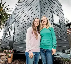  ??  ?? Vannesa Ortiz, left, and Jessica Ortiz outside the tiny home they built together.