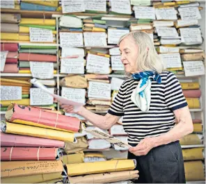 ??  ?? Edda Tasiemka at home amid her cuttings collection: she lived in terror that she might be closed down as a fire risk and listed herself on official forms as a ‘researcher’ rather than ‘librarian’