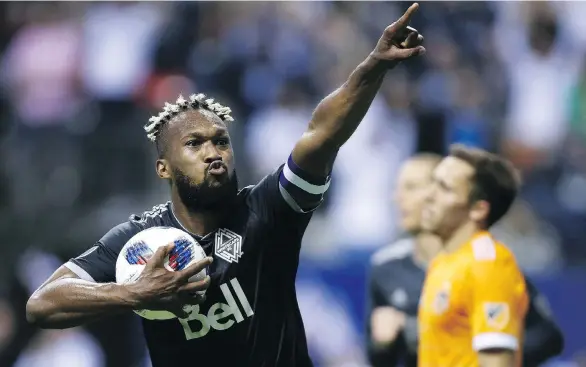  ?? THE CANADIAN PRESS/BEN NELMS ?? Whitecaps defender Kendall Watson celebrates his tying goal against the Houston Dynamo with only seconds left in injury time on Friday at B.C. Place.