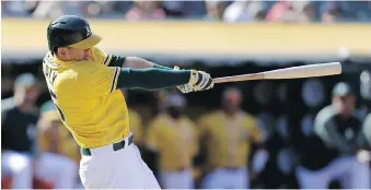  ?? BEN MARGOT/AP ?? Oakland A’s designated hitter Ryon Healy hits a walk-off homer off Detroit Tigers closer Francisco Rodriguez in the ninth inning Sunday in Oakland. It was Rodriguez’s fourth blown save of the season.