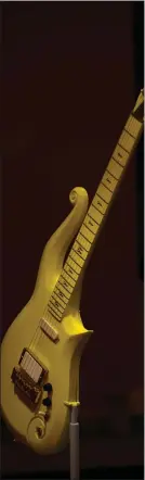  ?? ASTRID RIECKEN — FOR THE WASHINGTON POST ?? Pictured is the late Prince’s iconic “Yellow Cloud” guitar.