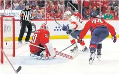  ?? ?? DECISIVE MOMENT: Panthers centre Carter Verhaeghe, centre, scores the gamewinnin­g goal against the Capitals.