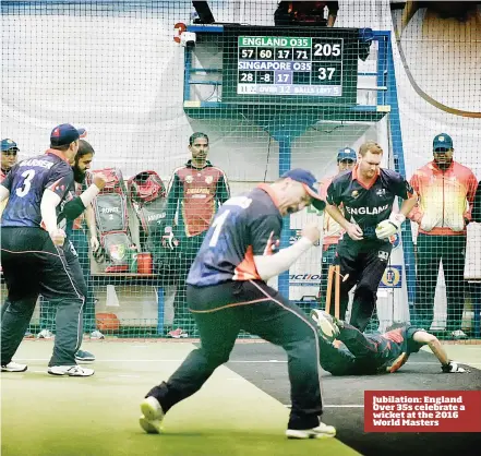  ??  ?? Jubilation: England Over 35s celebrate a wicket at the 2016 World Masters