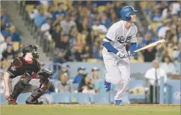  ?? Gina Ferazzi Los Angeles Times ?? CODY BELLINGER, watching a home run against the Miami Marlins, has been key to the Dodgers’ success. The team was 9-11 when he joined them from minors.
