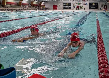  ?? STACY SQUIRES/STUFF ?? Members of the Wharenui Swim Club train at the Wharenui Swimming Pool and Sports Centre in Riccarton. The club, which has a rich history in New Zealand and Canterbury sport, leases the facility from Christchur­ch City Council.