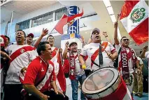  ?? PHOTO: ABIGAIL DOUGHERTY/STUFF ?? Peru supporters make their presence felt at Auckland Airport as they greet their team.