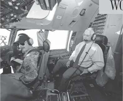  ?? ALEX BRANDON / THE ASSOCIATED PRESS ?? U.S. Secretary of State Rex Tillerson talks with the pilots in the cockpit of a C-17 aircraft Monday on the way to Bagram Air Base in Afghanista­n. Tillerson met with Afghan President Ashraf Ghani and other Afghan leaders.