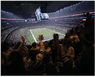  ?? (AP/Roger Steinman) ?? Fans cheer at a Dallas Cowboys playoff game in January 2019. Texas Gov. Greg Abbott issued an executive order declaring that sports venues can be opened at 50% capacity. The order means the Cowboys could allow 45,000 fans to attend their home games at AT&T Stadium in Arlington.