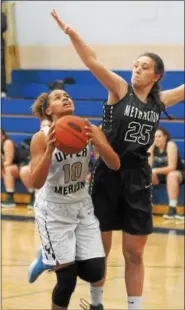  ?? GENE WALSH — DIGITAL FIRST MEDIA ?? Upper Merions Jordan Wilson drives to the basket against Methacton.