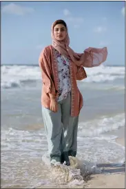  ?? (AP/Khalil Hamra) ?? Palestinia­n Ruba Shabit, 23, poses for a portrait Sept. 23 as she stands on the beach of Gaza City.