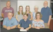  ?? Graham Thomas/Siloam Sunday ?? Siloam Springs senior Chandler Stewart signed a letter of intent Tuesday to run track at the University of the Ozarks in Clarksvill­e. Pictured are: Front from left, father Jeff Stewart, Chandler Stewart, mother Kristin Stewart; back, Siloam Springs...