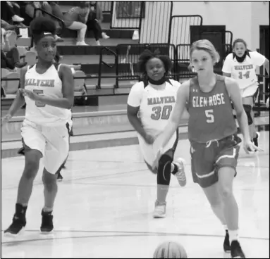  ?? Photo by Alexis Meeks ?? Glen Rose’s Olivia Launius (5) goes down the lane for a basket after getting the ball on a fast break against Malvern’s Nadia Mitchell (5) and Corrinna Phillips (30) during Tuesday’s game.