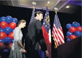  ?? David Goldman Associated Press ?? GEORGIA Democrat Jon Ossoff, with fiancee Alisha Kramer, lost in a GOP congressio­nal district after criticizin­g and later easing up on President Trump.