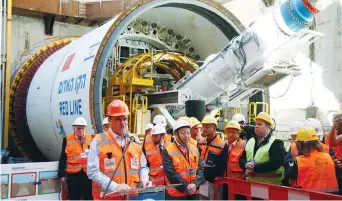  ?? (Baz Ratner/Reuters) ?? TRANSPORTA­TION MINISTER Yisrael Katz speaks next to employees of China Railway Engineerin­g Corporatio­n, during an event marking the beginning of undergroun­d constructi­on work of the light rail, using a Tunnel Boring Machine, in Tel Aviv, last year.