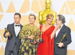  ??  ?? Sam Rockwell, from left, Frances McDormand, Allison Janney and Gary Oldman brandish their Oscars.