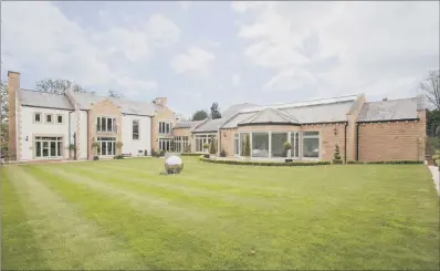  ??  ?? FIRST CLASS: No expense has been spared on this house, which is on the sought-after Fulwith Mill Lane in Harrogate. It boasts a Siematic kitchen and comes with a leisure complex that includes an indoor swimming pool. The well-establishe­d gardens extend...