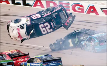  ??  ?? Brendan Gaughan (62) flips in Turn 3 during a NASCAR Cup Series auto race at Talladega Superspeed­way on Oct 14 in Talladega, Alabama. (AP)