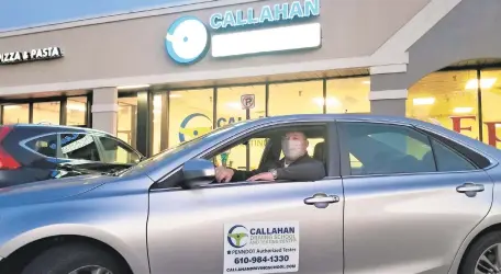  ??  ?? Callahan Driving School and Testing Center co-owner Bryan Callahan displays one of the business’ cars in front of the newly opened facility in Bethlehem Township.