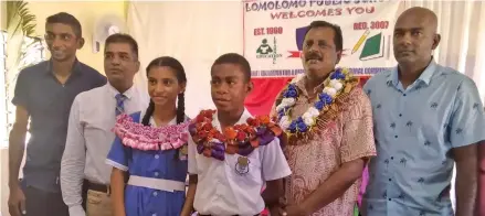  ?? Photo: Fijian Government ?? From left: Lomolomo Public School President Sanjay Chetty, Headteache­r Newal Umrao, Head Girl Tanvi Chetty, Head Boy Jovilisi Vuketu, Minister for Employment, Productivi­ty and Industrial Relations, Youth and Sports, Parveen Bala and School Manager Muniapa after the school’s prefects induction ceremony on May 5, 2022 in Lautoka.