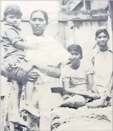  ?? Picture: FILE ?? Daya Wati and her children (left to right) Dharmesh Kumar, 4, Raj Pati, 13, and Sunita Devi, 17, beside the ruins of their home after Cyclone Bob.