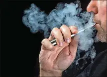  ?? DREAMSTIME / TNS ?? New research from the U.K. shows that smoke from e-cigarettes can shut down your lungs’ protective cells that ward off bacteria and allergens, in addition to causing general lung-cell inflammati­on.