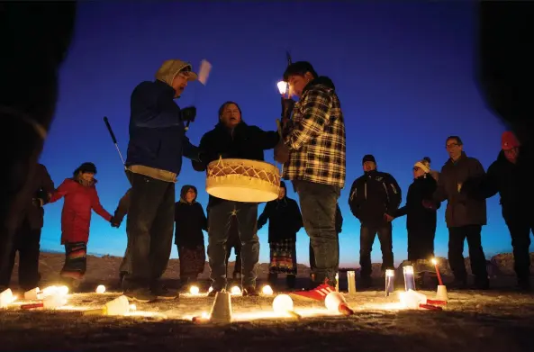  ?? KAYLE NEIS ?? Friends, family and supporters of Colten Boushie hold a candleligh­t vigil on Saturday at the Chapel Gallery in North Battleford.