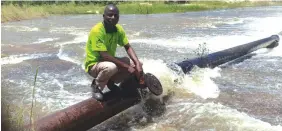  ??  ?? Rusape Town Council acting engineer, Engineer Silas Govero attend to the pipes swept away by the floods