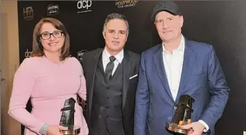  ?? Richard Shotwell / Associated Press ?? Marvel Studios president of production Victoria Alonso, left, and Marvel Studios president Kevin Feige, right, pose with actor Mark Ruffalo. Alonso started in 2006 co-producing “Iron Man.” Her 25 Marvel movies have grossed $23 billion.