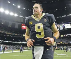  ??  ?? Saints QB Drew Brees angered teammates and many others by saying he equates taking a knee with disrespect­ing the American flag.
DERICK E. HINGLE/
USA TODAY SPORTS