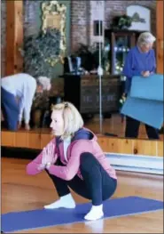  ?? PETER HVIZDAK — NEW HAVEN REGISTER ?? Sylvia Desantis of Branford, 59, during a Shoreline Village CT Stretch & Balance Class at the Arthur Murray Studio in Guilford. Desantis is the director of services at the Shoreline Village CT, a non-profit organizati­on that helps seniors on the...