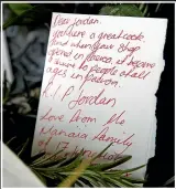  ??  ?? Messages of sympathy were left outside the Mykonos Pizza shop owned by Jordan Voudouris.