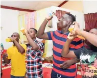  ??  ?? It was down to the wire in the soda-drinking contest for these young men.