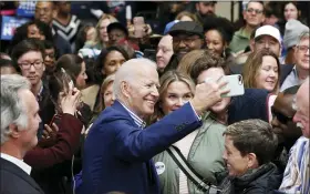  ?? GERRY BROOME — THE ASSOCIATED PRESS ?? Democratic presidenti­al candidate former Vice President Joe Biden takes photos with supporters at a campaign event at Saint Augustine’s University in Raleigh, N.C., Saturday.