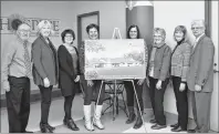  ?? ELIZABETH PATTERSON/CAPE BRETON POST ?? Board and staff members of the Hospice Palliative Care Society of Cape Breton County at the 10th anniversar­y reception held outside the An Cala palliative care unit on Monday show off the proposed hospice residence that they hope will eventually become...