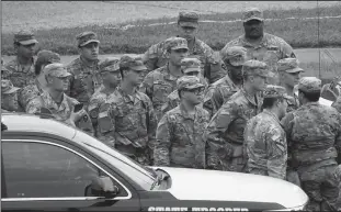  ?? SMILEY N. POOL/DALLAS MORNING NEWS ?? National Guard troops gather nearby as demonstrat­ors rally at the Frank Crowley Courts Building as protests continue after the death of George Floyd on June 1, in Dallas. The Texas National Guard is set to send up to 1,000 troops to major cities for support after election.