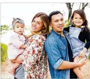  ?? VICTORIA BREWER ?? Michaela Clark of Austin, seen here with her fiancé and their two young daughters, was shot in the back Sunday at the Route 91 Harvest Festival in Las Vegas. She is expected to make a full recovery.