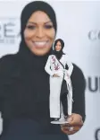  ??  ?? Ibtihaj Muhammad and the Barbie doll modelled after her.