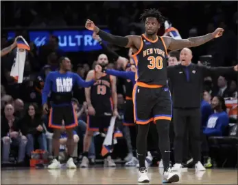  ?? JOHN MINCHILLO — THE ASSOCIATED PRESS ?? Knicks forward Julius Randle reacts as his team maintains their lead in the second half of Sunday’s game against the 76ers in New York.