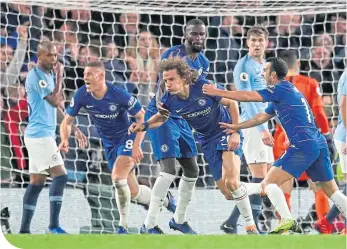  ??  ?? David Luiz turns to celebrate his effort goal heading Chelsea into an unassailab­le lead