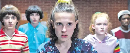  ?? Stranger Things. ?? Actress Millie Bobby Brown (front) leads the young cast in the hit Netflix series