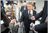  ?? The New York Times/ERIN SCHAFF ?? Sen. Rand Paul, R-Ky., said Wednesday that he had not decided how he would vote on the new spending bill until he had read it. He criticized the process in drafting the 2,000-plus-page bill, saying: “It’s a really terrible, rotten, no-good way to run...