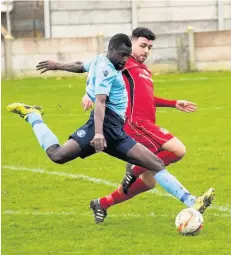  ?? Paul Watson ?? Runcorn Town striker Isaac Kusaloka shoots for goal.