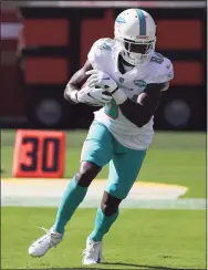  ?? Jed Jacobsohn / Associated Press ?? Miami Dolphins wide receiver Isaiah Ford warms up before a game against the San Francisco 49ers.